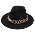 Detail of black fedora hat featuring a chunky rose gold acrylic chain and wool texture - Black