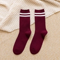 Knitted dark red crew socks with white stripes in a professional flat lay setup - One Size / Burgundy