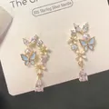 Zoete strik pareloorbellen met blauw email en S925 zilveren steker voor dames - 925 Zilveren Naald/Legering/Email/Parel/Zirkoon / Diamanten Bloem met Blauwe Vlinderhanger