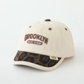 Detail of cream corduroy kids cap with leopard brim and Brooklyn embroidery - Brooklyn / Off White