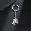 Silver metal keychain with delicate floral tree life pendant on a dark background - 089-Leaf Flower