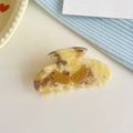 Elegant marbled acetate hair claw with golden wings and sparkling rhinestones - Yellow Marble Acetate Claw Clip