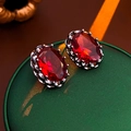 Macro shot of oval red gemstone earrings with vintage dark metal floral settings - Red (Gun Black Base/S925 Silver Needle)