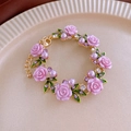 Detail of flower bracelet with pink resin roses and purple pearls on golden chain - Bracelet-Purple