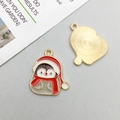 Detailed view of enamel penguin pendant showing golden plating and textured reverse side - Christmas Penguin (17x21mm)