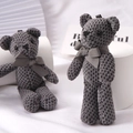 Cute grey knitted teddy bear bag pendant with bow tie ribbon on a white background - Gray