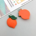 Close-up of resin orange fruit charms with metal loops for DIY jewelry making - Orange Resin Orange / 18*25mm