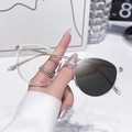 Lightweight photochromic glasses with transparent round frames and gold metal temples - Photochromic Grey / Transparent Gold Frame
