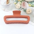 Matte orange rectangular hair claw clip with cutout leopard pattern for hair styling - XP Orange Red