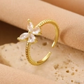 Elegant gold bow open ring with marquise zircon crystals on a twisted metal band - Gold Butterfly Twist Ring (WG-0520)