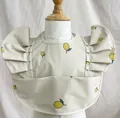 Waterproof baby bib with yellow lemon print and ruffled wings featuring food catcher pocket - Wings - Yellow Lemon / One Size