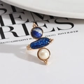 Gold ring with vertical blue stone, stardust resin, and white pearl inlay design - White Pearl + Lapis Lazuli