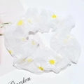 White organza scrunchie with yellow daisy floral pattern on light background - White Mesh Daisy