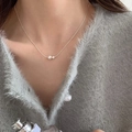 Elegant silver necklace with double pearls design worn on a grey knit cardigan - Minimalist Double Artificial Pearl Necklace (XL2493)