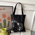 Close-up of black canvas tote bag with a cute cartoon bear holding an ice cream pattern - Black with Ice Cream Bear