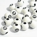 Macro shot of white acrylic beads with black number 8 print and holes for DIY crafts - 12mm Billiard Ball White Background Black Line