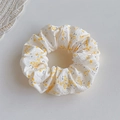 Detail of floral scrunchie with yellow flower pattern on beige fabric for ponytails - Yellow Floral