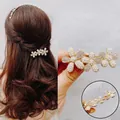 Elegant gold flower hair clip with pearls and rhinestones shown on model and in detail - Pearl Rhinestone Rouge Flower Spring Clip