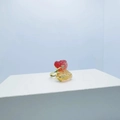 Golden bear ring featuring a vibrant red and yellow gradient gemstone on white pedestal - Ring / Red and Yellow