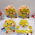 Close-up of yellow round emoji erasers with various moods and creative packaging - Emoji Face Set