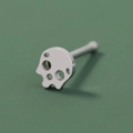Macro view of a silver polished hollow skull stud nose ring with punk gothic style - SE1595 Silver Skull