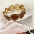 Dettaglio del bracciale elastico leopardato con cordino elastico a doppio filo - Oro-Rosa