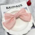 Elegant large pink satin bow hair clip for women with a premium fabric spring design - Ice Cream Pink
