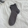 Dark grey crew socks with ruffle trim and vertical ribbed texture in Japanese style - One Size / Smoke