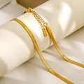 Macro shot of gold stainless steel snake chain showing the clasp and S.STEEL hallmark - 3mm Width 40cm Length / Gold