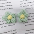 Handmade crochet milk cotton flower in mint green and yellow for DIY accessories - Aqua Green with Yellow Center