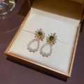 Detail of floral gold earrings with green gemstone and white pearls in a jewelry box - 37# Silver Needle-Gold-Green