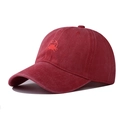 Close-up of vintage washed red baseball cap featuring detailed crab embroidery on cotton - Adjustable / Orange