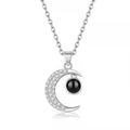 Silver crescent moon projection necklace with black stone and white zircon pave details - Silver Moon