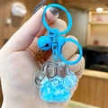Blue cat paw quicksand keychain with bell and biscuit charms for bag decoration - Small Cat Claw Letter - Blue