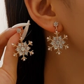 Champagne gold snowflake earrings featuring sparkling rhinestones and white faux pearls - Gold Snowflake Drop Earrings Style (G-415)