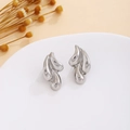 Close-up of abstract silver-polished heart-shaped earrings with unique folded textures - Silver Streamlined Abstract Flame (E7118)