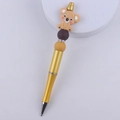 Detail of golden ballpoint pen with cartoon koala topper, colored beads, and rhinestone rings - Yellow Koala
