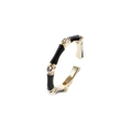 Detailed view of an adjustable bamboo-style ring with gold plating and black enamel inlay - Black