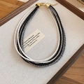 Detail view of multi-layer beaded necklace with black, white, and grey glass beads - Black-White-Grey