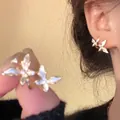 Elegant gold butterfly stud earrings featuring shimmering white zircon and double-wing design - Gold Full Diamond Double Butterfly Stud Earrings