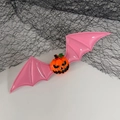 Halloween pink bat wing hair clip with orange pumpkin jack-o-lantern face detail - Pumpkin Pink