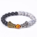 Detail of double dragon heads on beaded natural stone bracelet with matte black and white beads - White Turquoise and Matte Stone