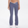 Detail of high-waisted yoga pants with white V-cross waistband and flared leg in dusty blue - Blue Gray