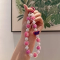 Pink and white beaded phone strap with YOT pendant and acrylic heart-themed beads - YOT Letter Pink