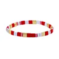 Detail view of handmade bohemian elastic Tila bead bracelet with red, white and gold tiles - Red White Pink Gold