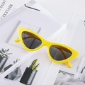 Stylish yellow cat-eye sunglasses with dark grey lenses on a minimalist background - Yellow Frame Grey Lens