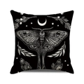 Macro shot of Halloween cushion cover with white moth, crescent moon, and stars pattern - White Moth Pattern