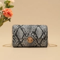 Mini crossbody flap bag with black and white snakeskin pattern and gold chain strap - Small Snake Print