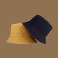 Detail showing foldable reversible bucket hat in mustard yellow and navy cotton canvas - M (56-58cm) / Turmeric & Black