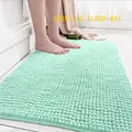 Absorbent mint green chenille bath mat with soft tufted texture for bathroom floors - Aqua Green